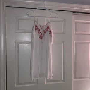 white dress with burnt orange designs